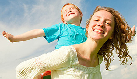 Mom and son playing airplane